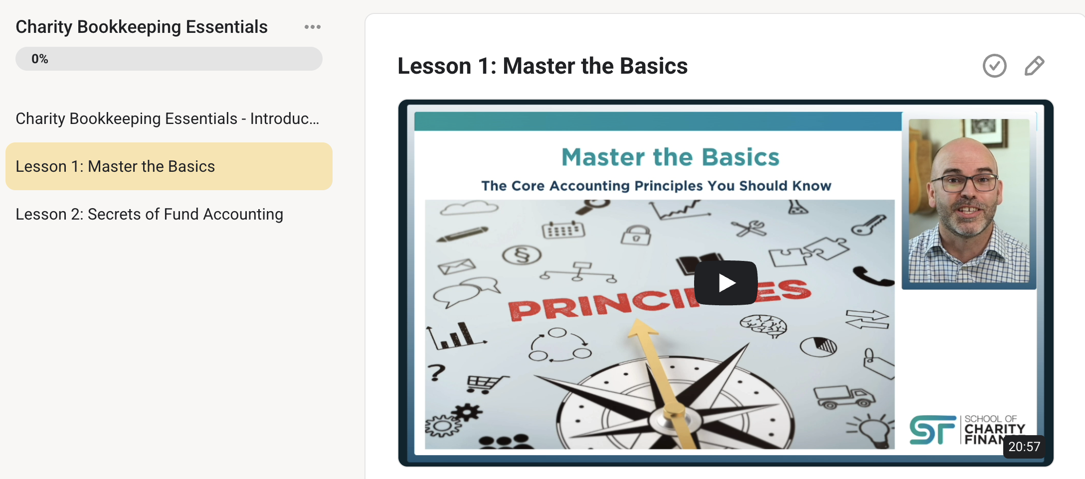 a smiling man and woman looking at a laptop in a coffee shop